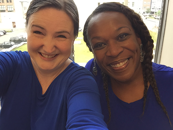 Image of two ladies smiling team image