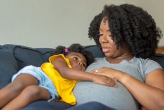 Pregnant mother and young child